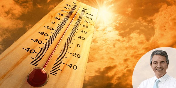 Thermometer measuring temperature with sunset sky background.