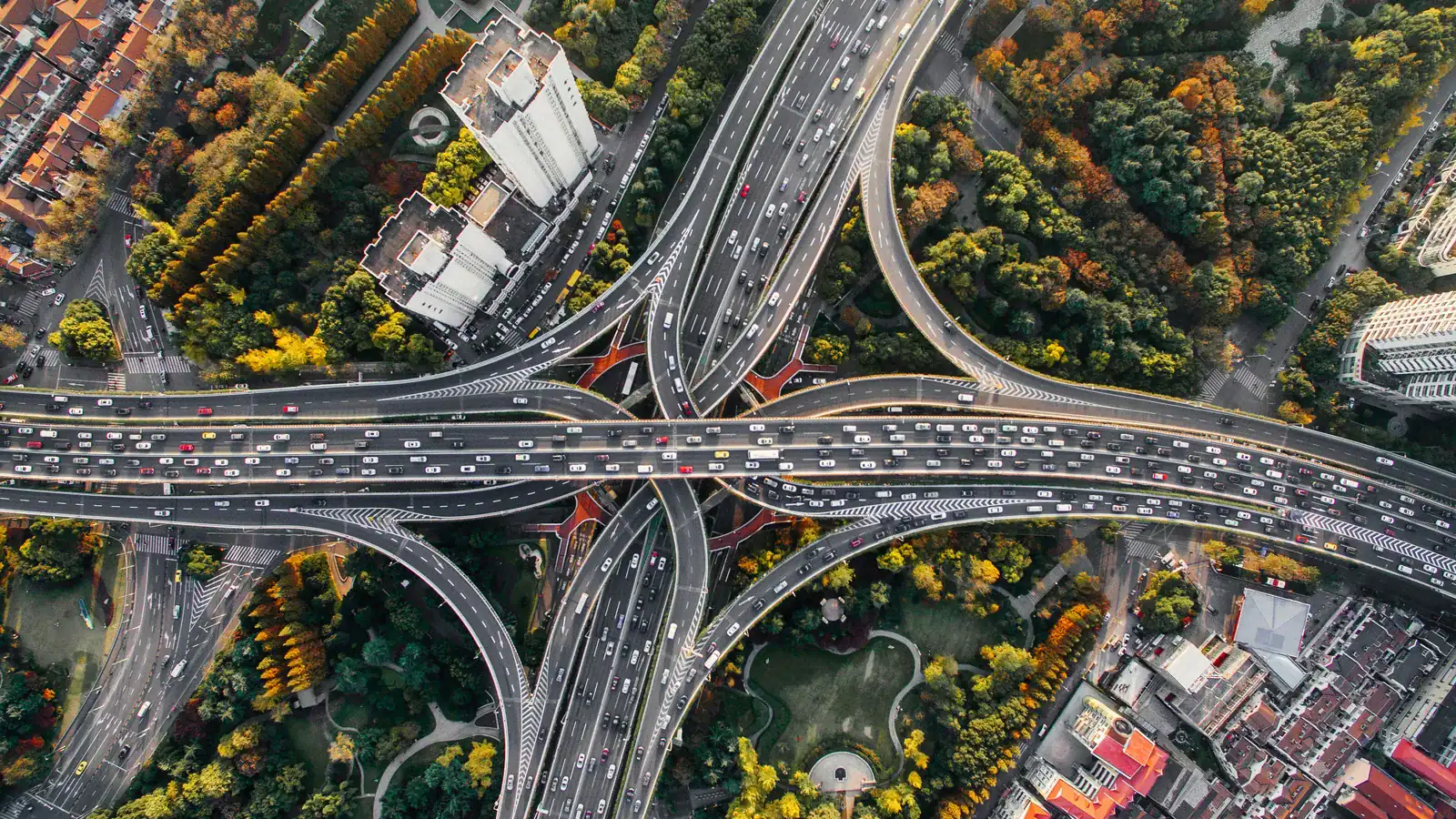 Aerial view of a multi-level highway interchange with traffic flows