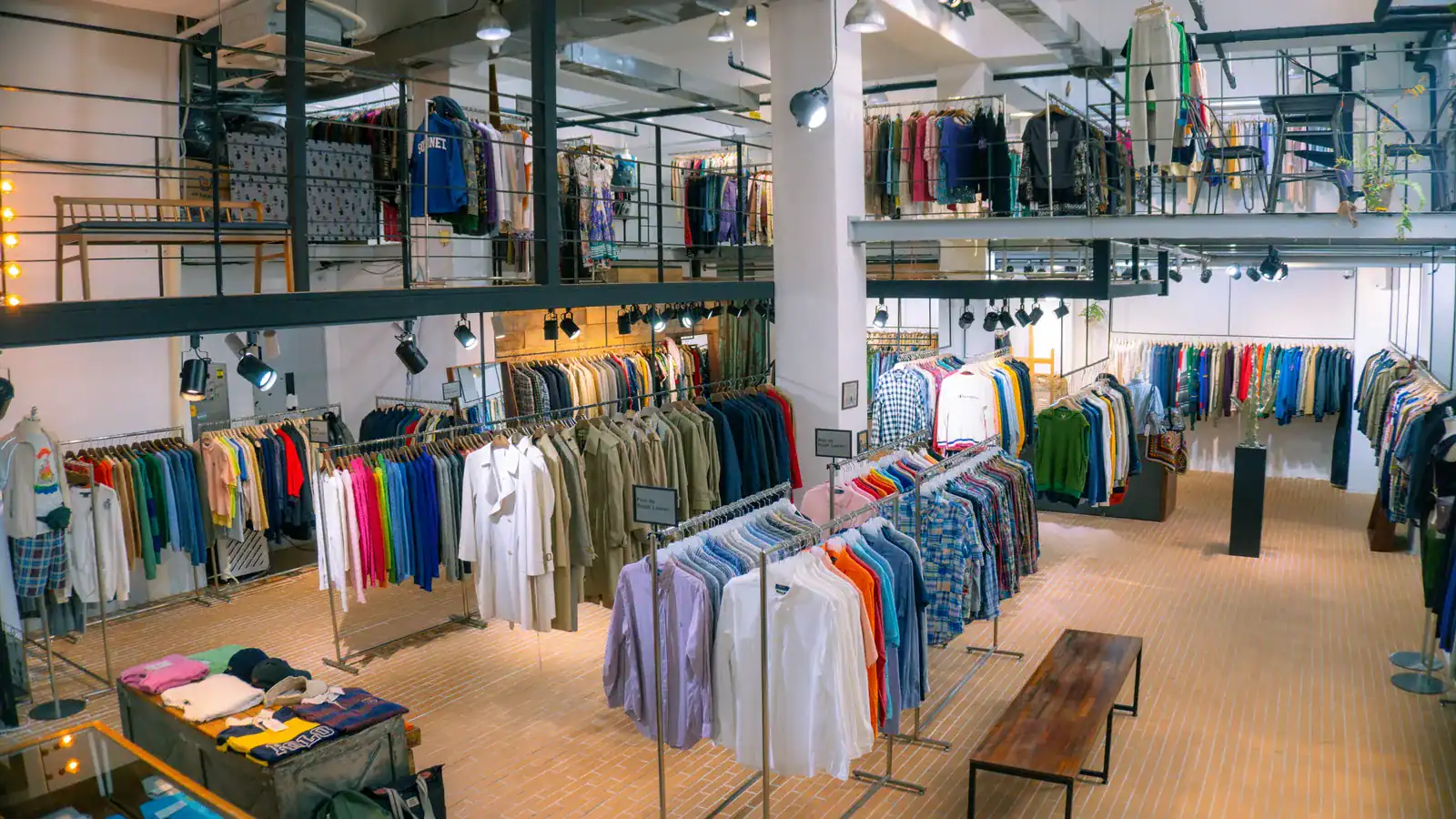 Clothing store interior with racks of apparel