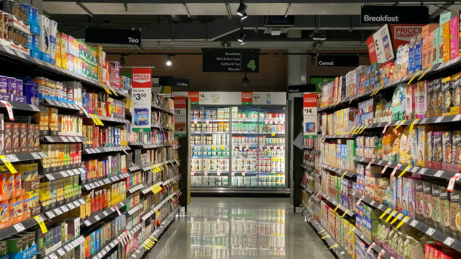 Grocery store aisle with fully stocked shelves
