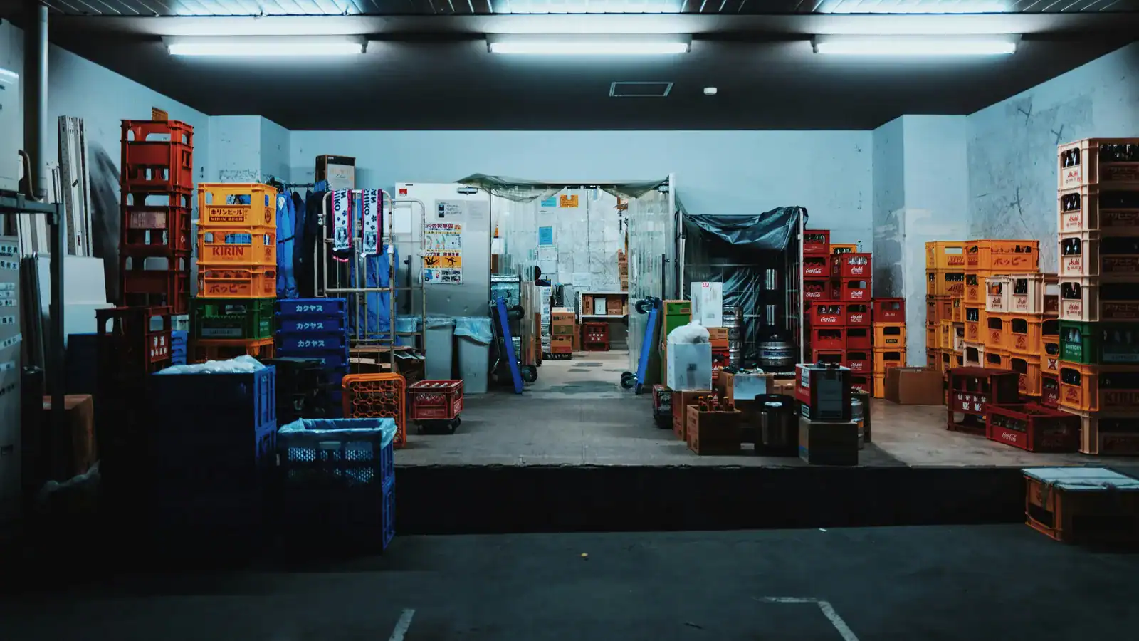 Stacks of plastic crates in a storage space